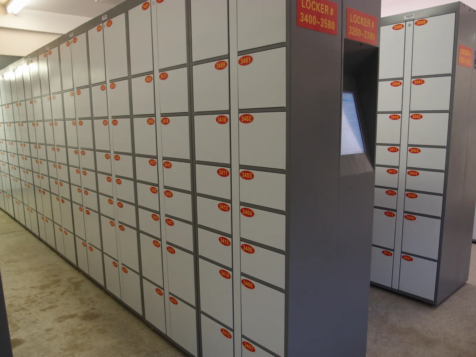Wall of secure 24/7 self-serve parcel lockers at In Out Parcel in Point Roberts, WA